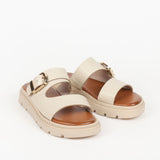 mules femme beige à double bride avec boucle dorée et semelle épaisse